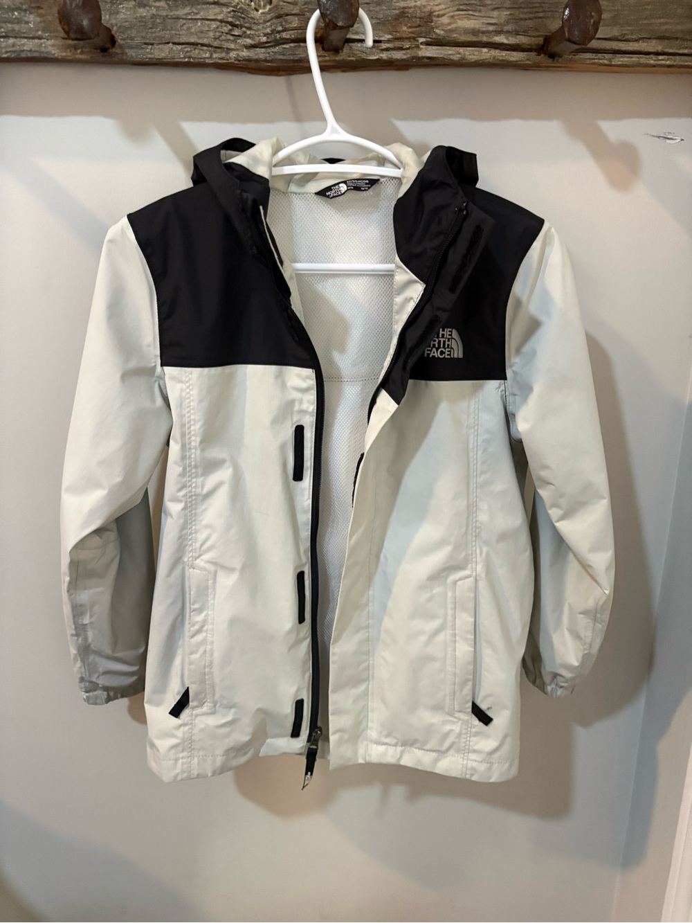 The North Face Kids Hooded Two-Tone Rain Jacket in Off-White and Black